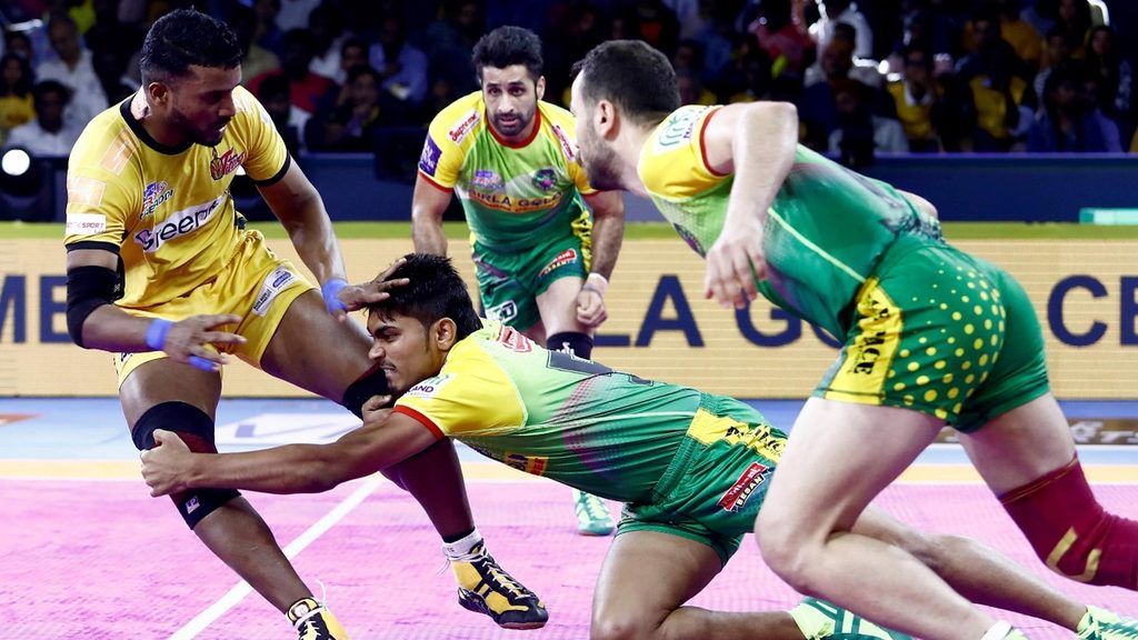 Patna Pirates’ Monu Super Tackles Telugu Titans Suraj Desai.