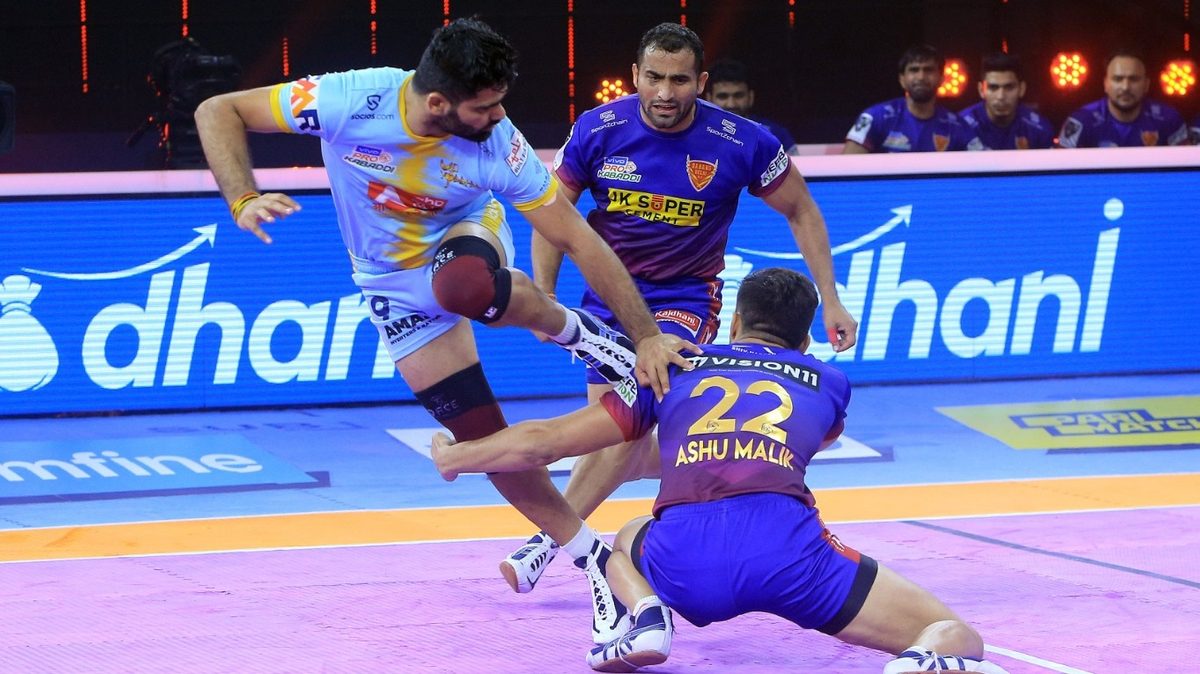 Pardeep Narwal of U.P. Yoddha tries to get away from Ashu Malik of Dabang Delhi K.C. in Match 117 of VIVO Pro Kabaddi League Season 8