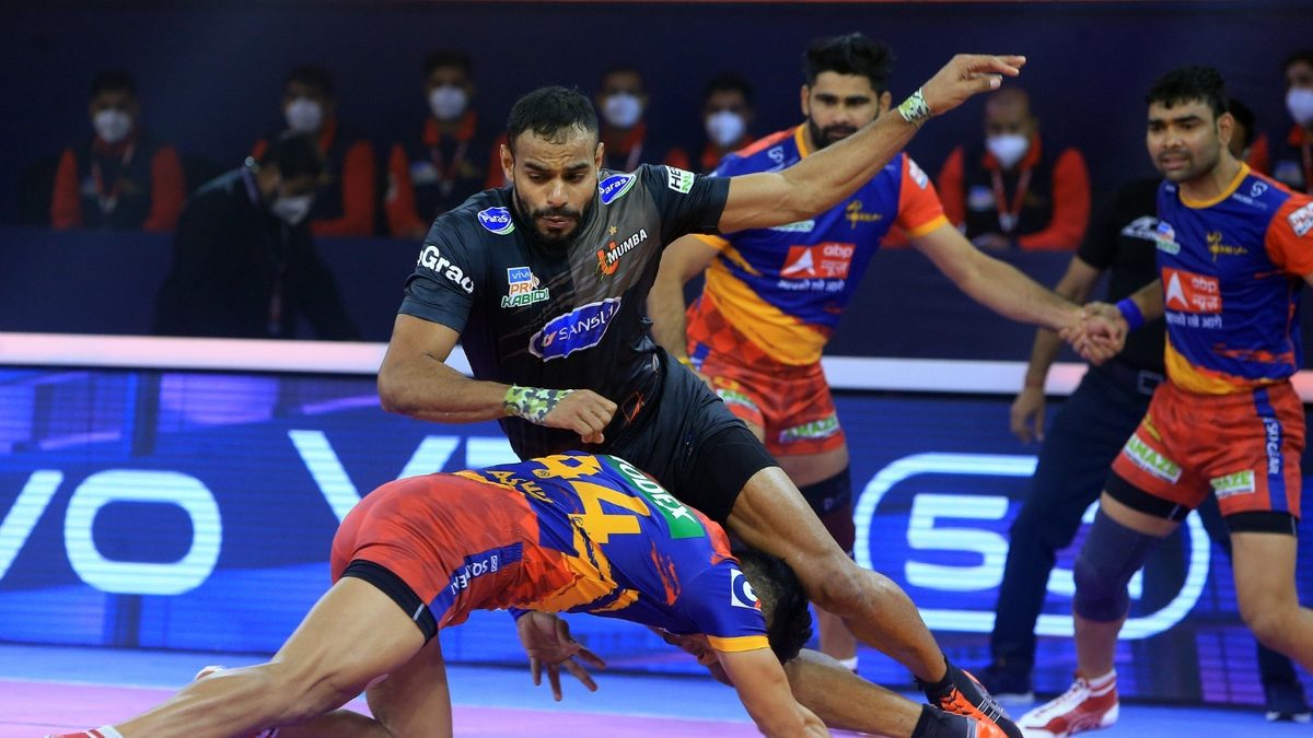 Abhishek Singh of U Mumba tries to avoid a tackle from the U.P. Yoddha defence in Match 124 of VIVO Pro Kabaddi League Season 8