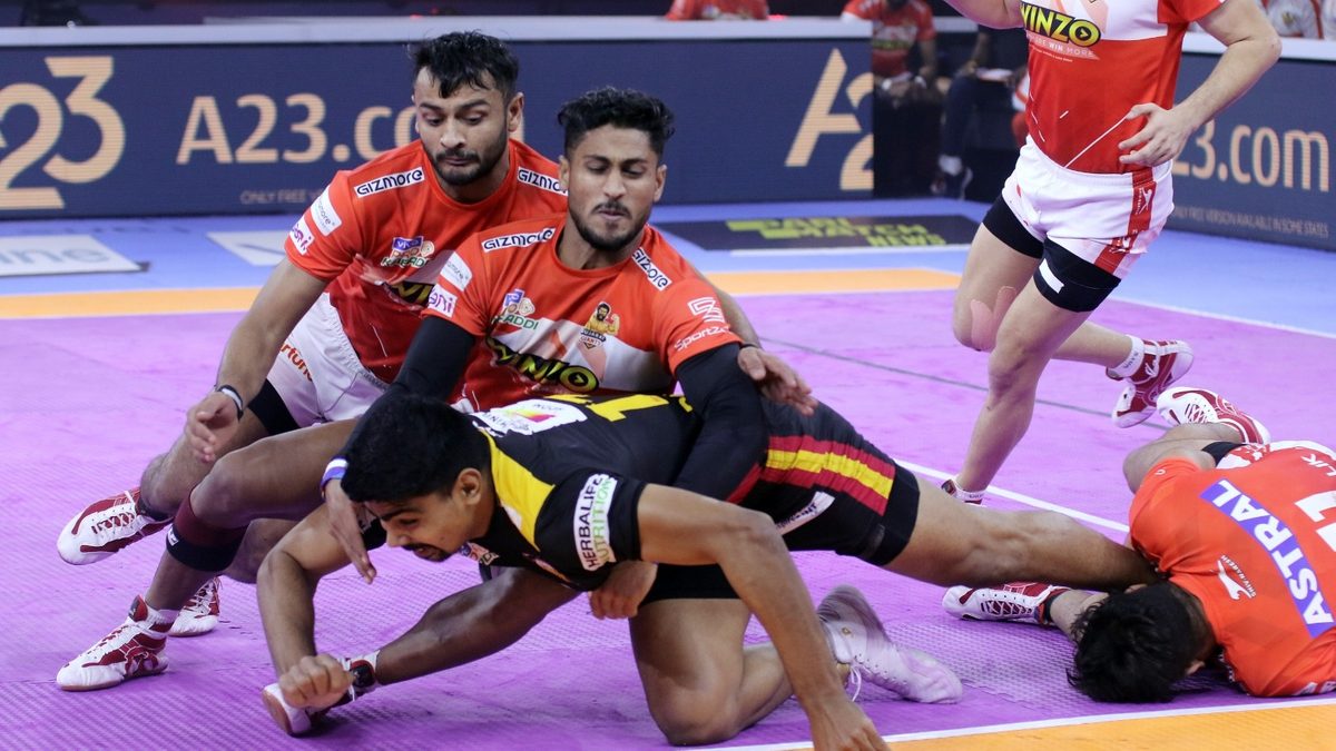Pawan Kumar Sehrawat of Bengaluru Bulls is pounced upon by the Gujarat Giants defense in Match 54 of VIVO Pro Kabaddi League Season 8.