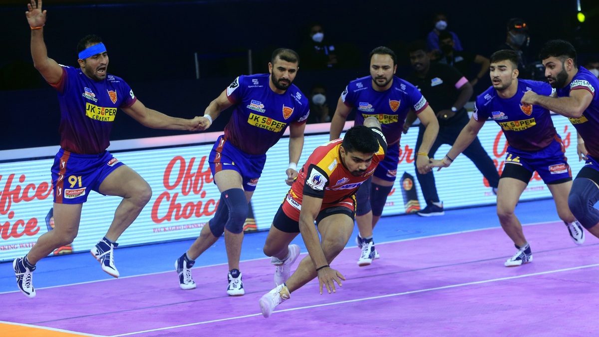 Bengaluru Bulls' Pawan Sehrawat looks to escape the defense of Dabang Delhi K.C. after securing a point in match 50 of VIVO Pro Kabaddi League Season 8