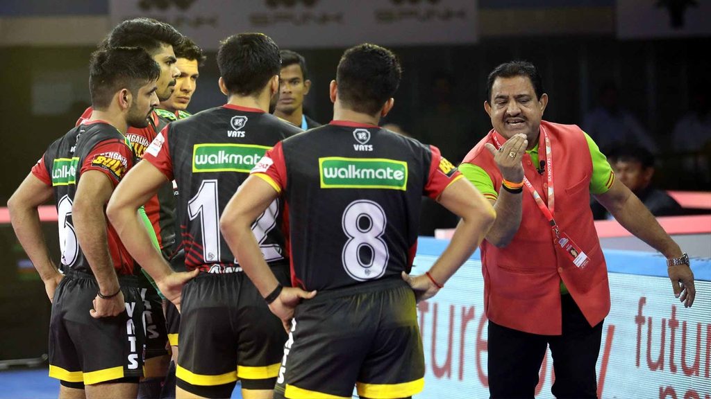 Bengaluru Bulls' coach Randhir Singh Sehrawat gestures as he advises his team during a time-out.