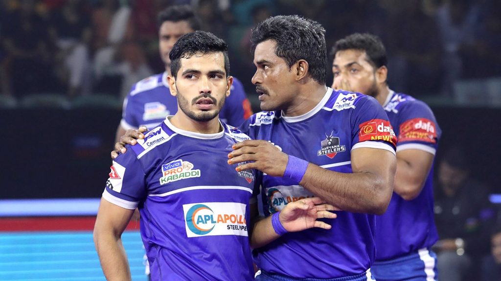 Dharmaraj Cheralathan gives Vikash Kandola instructions during the game.