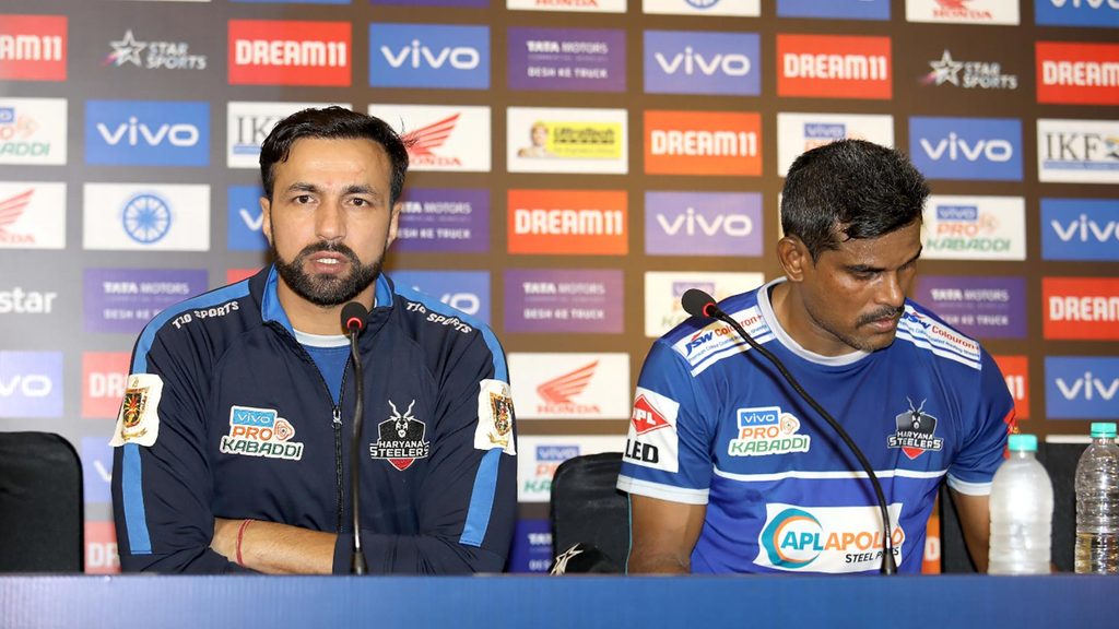 Coach Rakesh Kumar and Dharmaraj Cheralathan address the media.