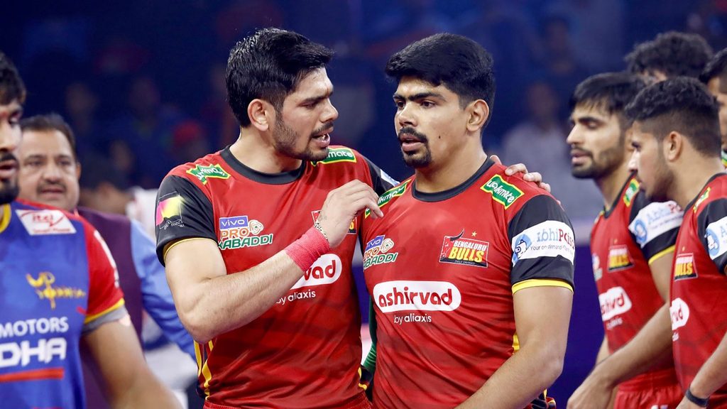 Bengaluru Bulls’ Rohit Kumar has a word with Pawan Sehrawat.