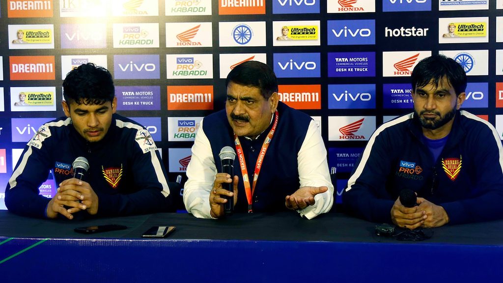 Dabang Delhi K.C. coach Krishan Kumar Hooda flanked by Naveen Kumar and Joginder Narwal.