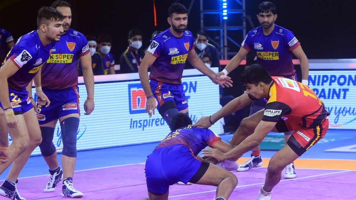 Pawan Sehrawat of Bengaluru Bulls looks to escape the hold of the Dabang Delhi K.C. defense in math 50 of VIVO Pro Kabaddi League Season 8