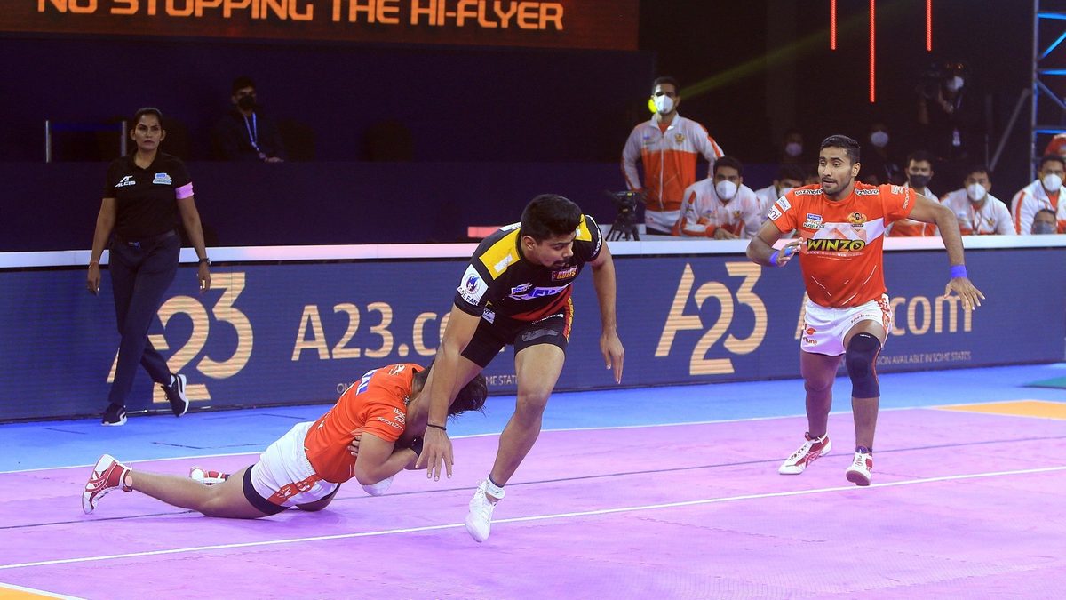 Pawan Kumar Sehrawat of Bengaluru Bulls tries to make the most out of his raid against Gujarat Giants in Match 54 of VIVO Pro Kabaddi League Season 8.