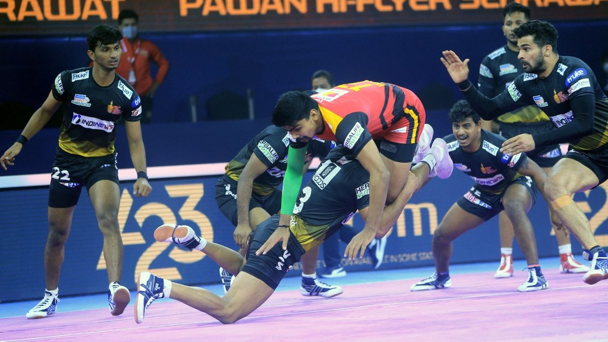 Bengaluru Bulls' captain Pawan Sehrawat is tackled by Telugu Titans' defence in Match 74 of VIVO Pro Kabaddi League Season 8.