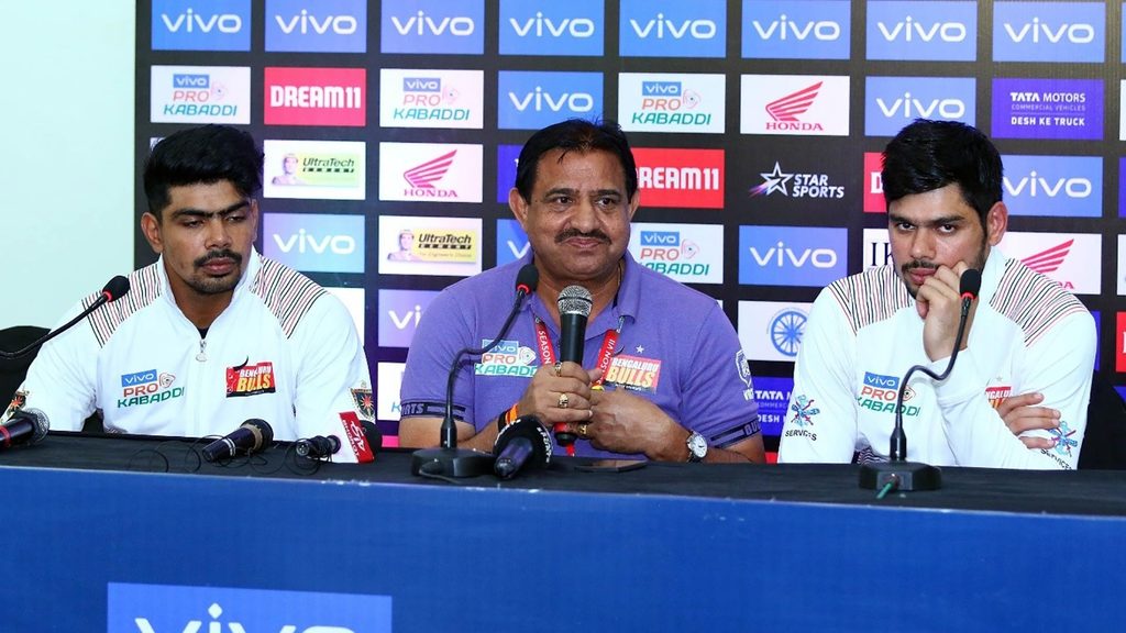 Pawan Kumar Sehrawat, coach Randhir Singh Sehrawat and Rohit Kumar address the media.