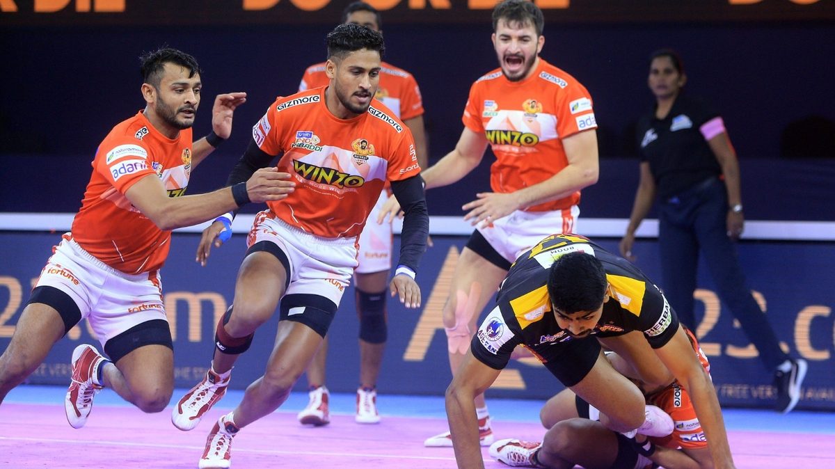 Pawan Kumar Sehrawat of Bengaluru Bulls tries to complete a successful raid against Gujarat Giants in Match 54 of VIVO Pro Kabaddi League Season 8.