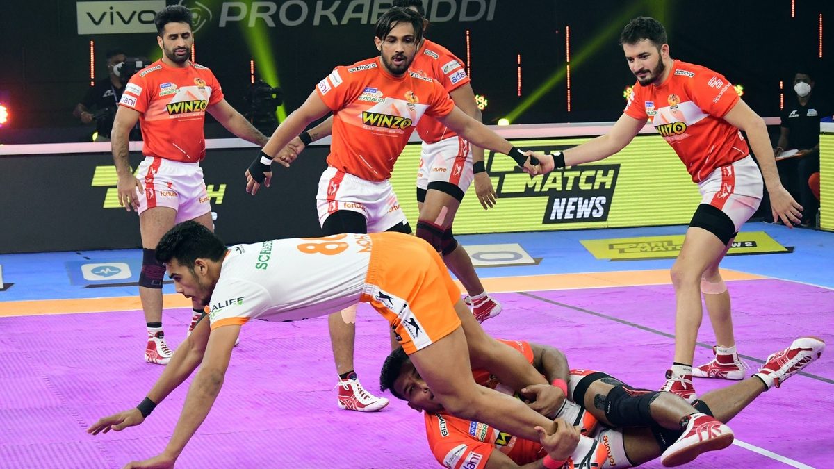 Mohit Goyat of Puneri Paltan tries to get past the clutches of Girish Ernak of Gujarat Giants in Match 118 of VIVO Pro Kabaddi League Season 8