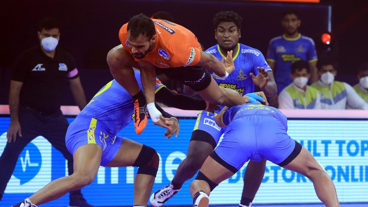 Abhishek Singh of U Mumba tries the aerial route to get past the Tamil Thalaivas' defense in Match 95 of VIVO Pro Kabaddi League Season 8