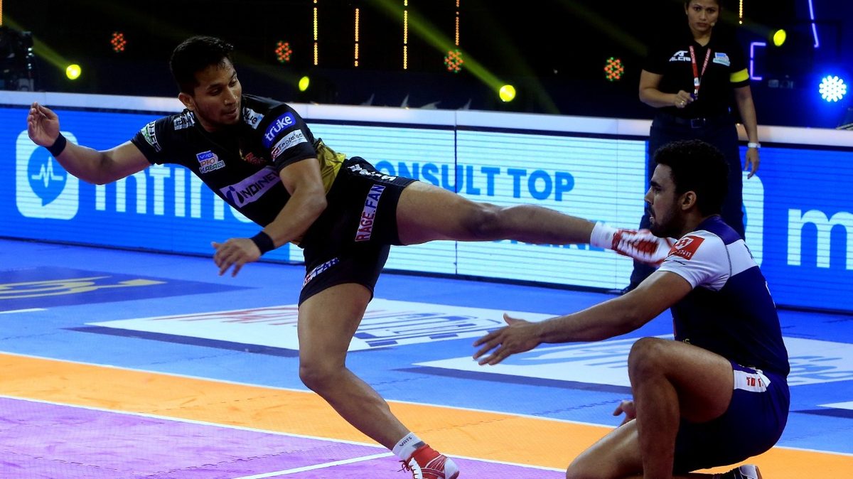 Telugu Titans' defender T. Adarsh attempts a raid point against Haryana Steelers in Match 77 of VIVO Pro Kabaddi League Season 8.