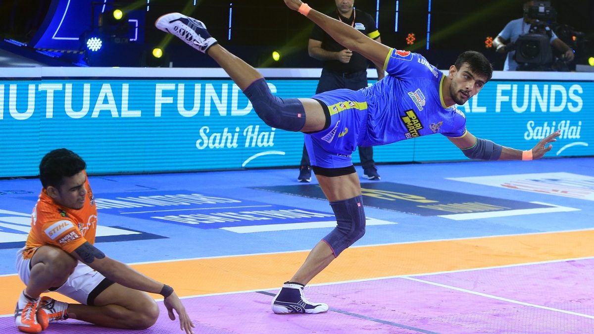 Manjeet of Tamil Thalaivas tries a kick to get a point off Mohit Goyat of Puneri Paltan in Match 121 of VIVO Pro Kabaddi League Season 8