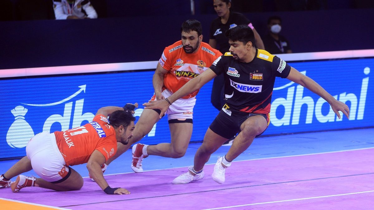 Pawan Kumar Sehrawat of Bengaluru Bulls tries to make the most out of his raid against Gujarat Giants in Match 54 of VIVO Pro Kabaddi League Season 8.