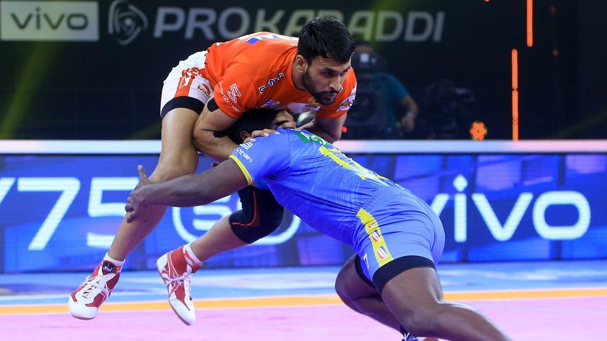 Pardeep Kumar of Gujarat Giants is tackled by M Abhishek of Tamil Thalaivas in Match 129 of VIVO Pro Kabaddi League Season 8