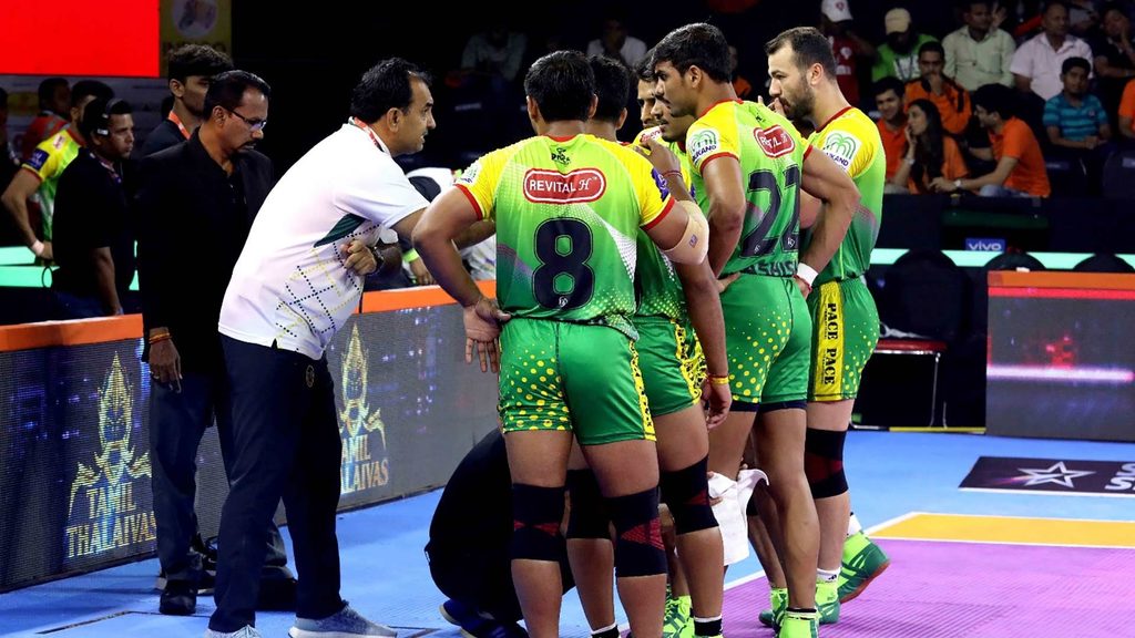 Patna Pirates coach Ram Mehar Singh gives his players instructions during a timeout.