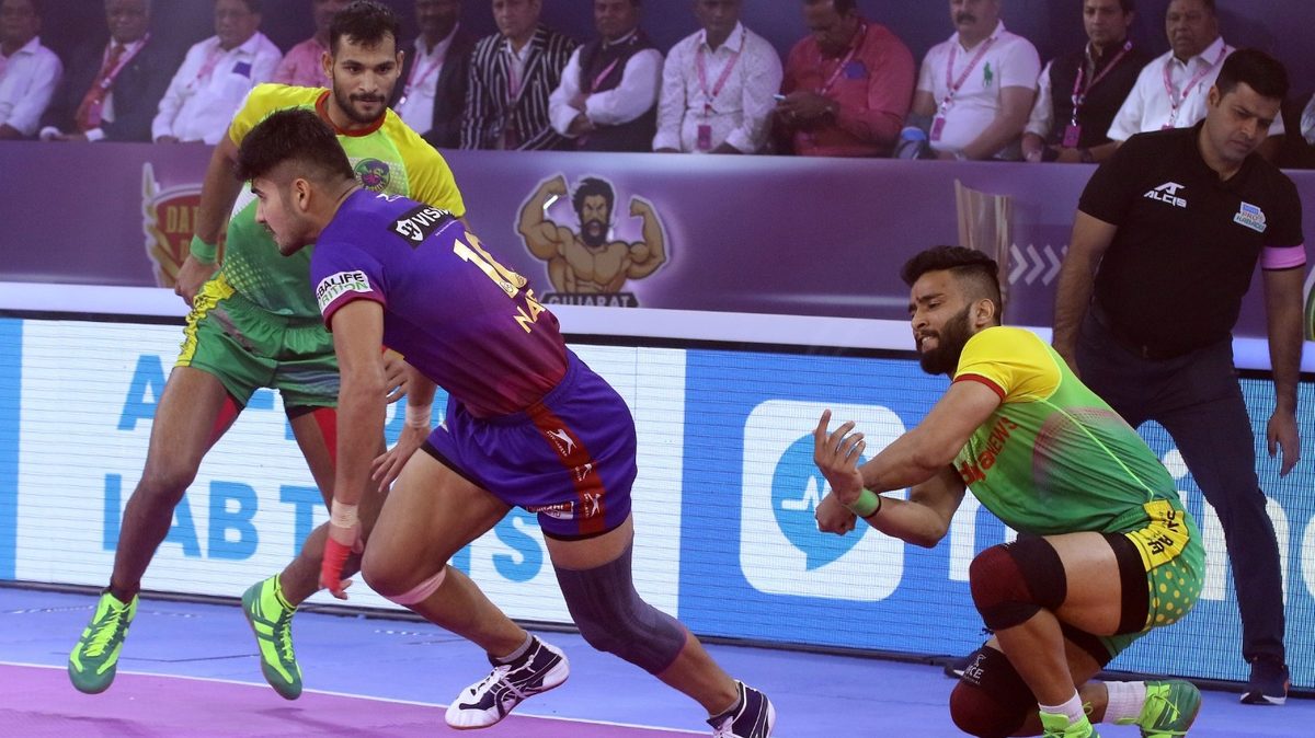 Dabang Delhi K.C.'s Naveen Kumar runs away from the Patna Pirates' defence in Final of VIVO Pro Kabaddi League Season 8